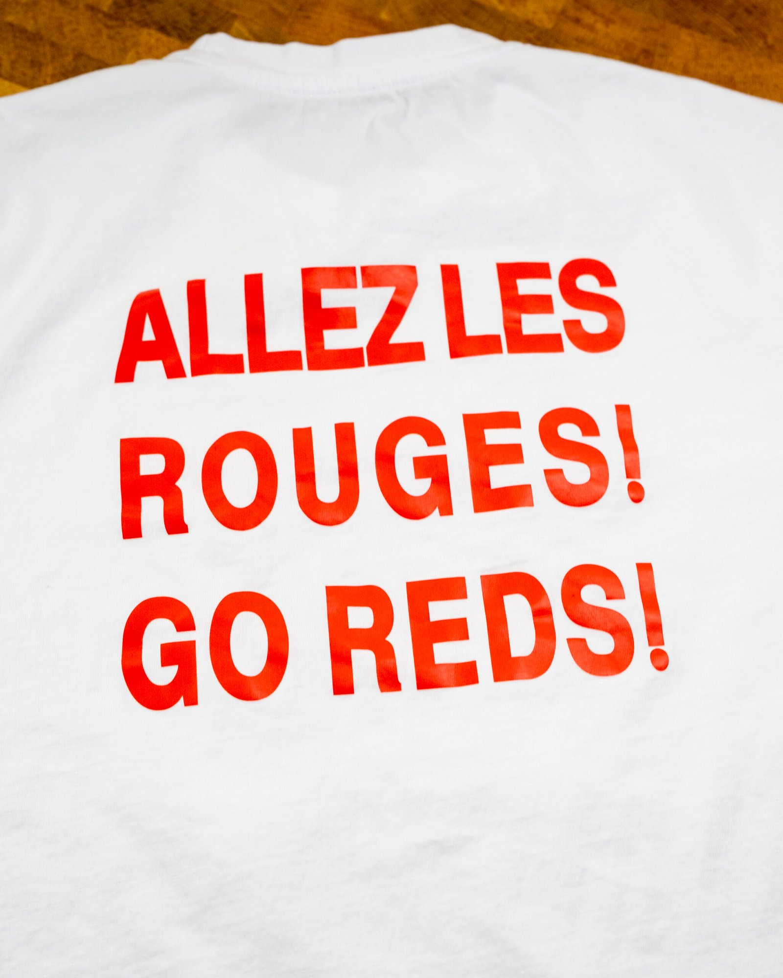 "Allez Les Rouges! Go Reds!" — Canada Brushstroke Crest Tee